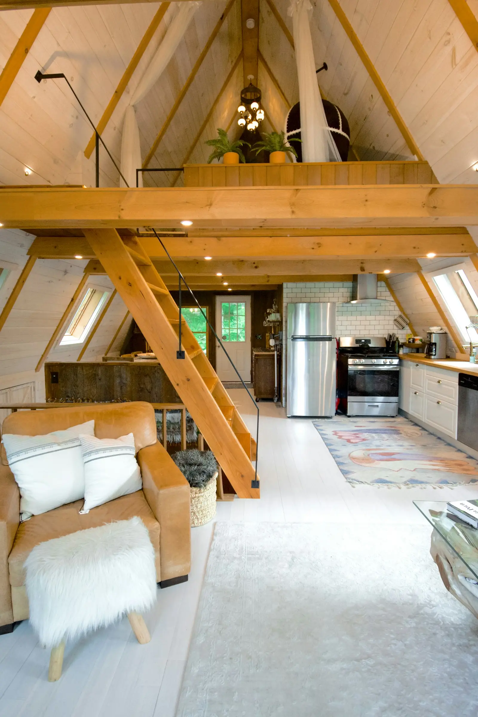 Loft conversion with exposed timber structure, small works design by David French Partnership